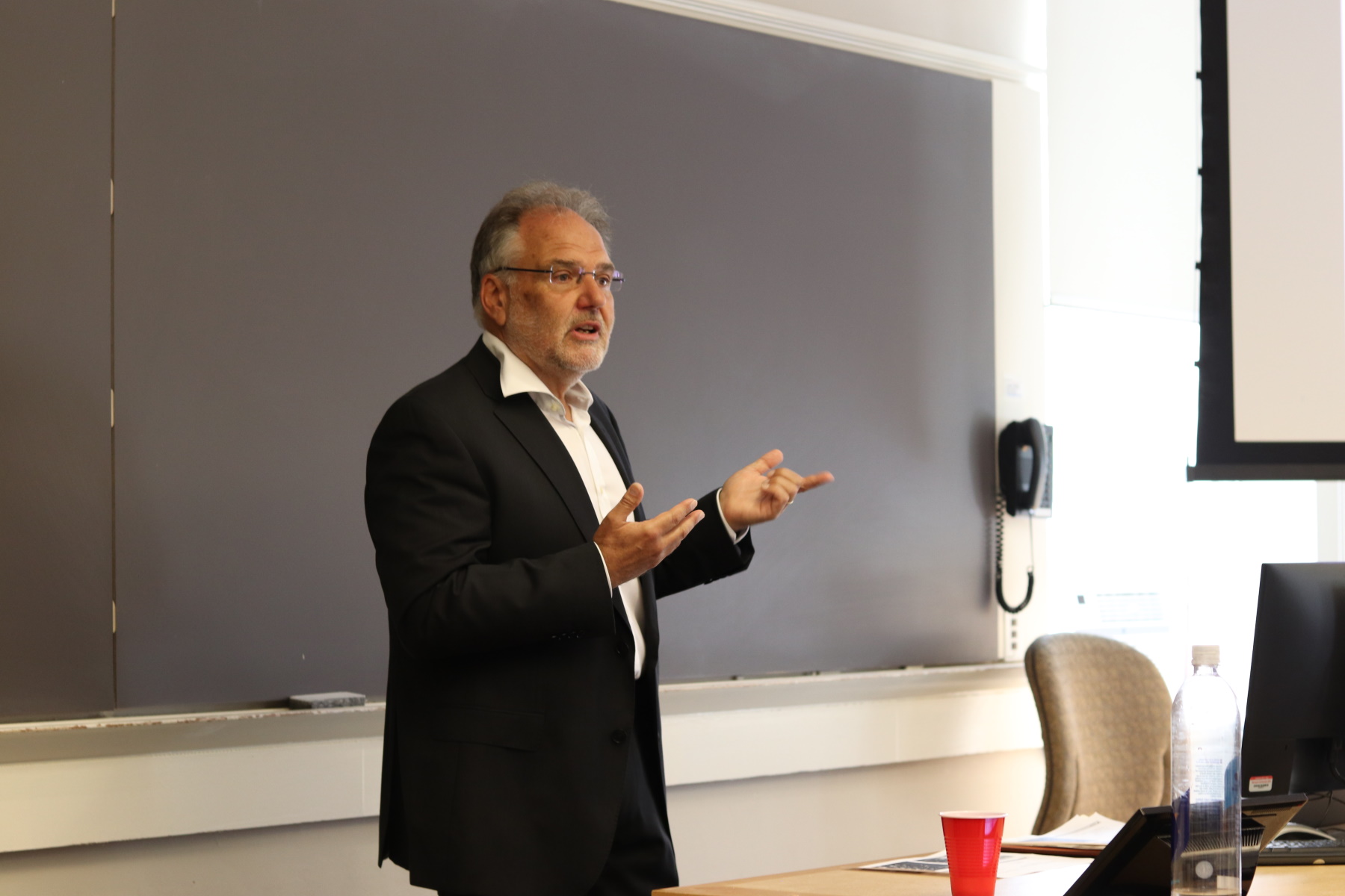 The classical seminar room: crammed with rows of chairs, blackboard and the lecturer behind the desk…Harvard Graduate School of Education.